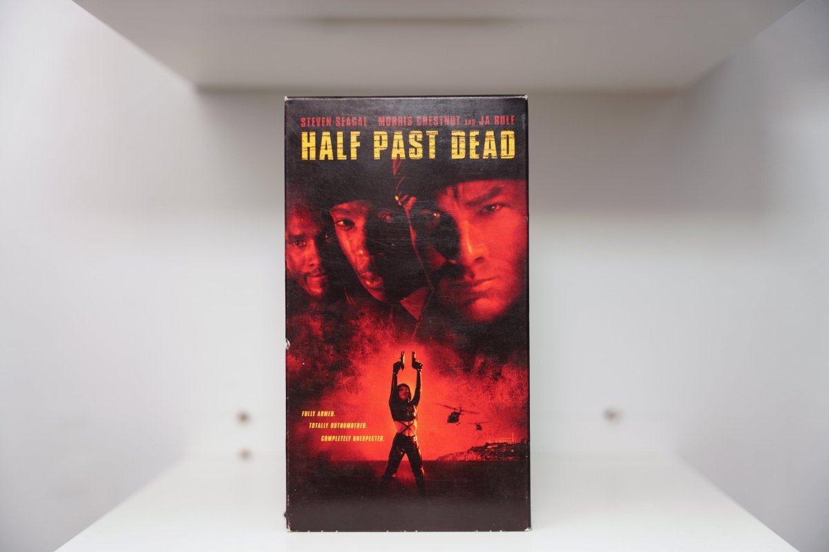 VHS Half Past Dead Steven Seagal Morris Chestnut Ja Rule red lighting silhouette guns helicopters HALF PAST DEAD yellow text