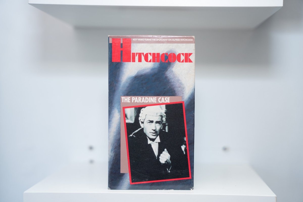 VHS Hitchcock The Paradine Case red HITCHCOCK text blue Hitchcock silhouette THE PARADINE CASE gray text red-bordered photo Key Video