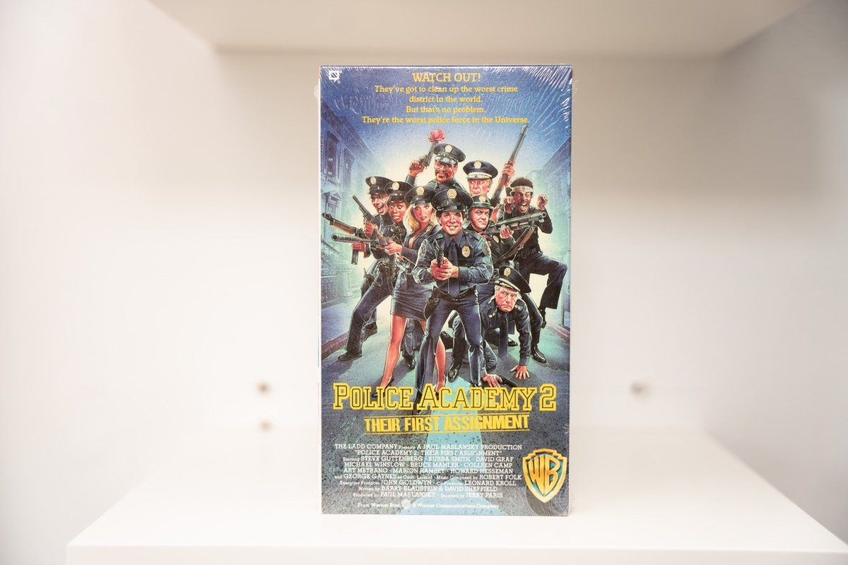VHS Police Academy 2 sealed shrink wrap painted artwork ensemble cast police uniforms POLICE ACADEMY 2 blue text Their First Assignment Warner Bros