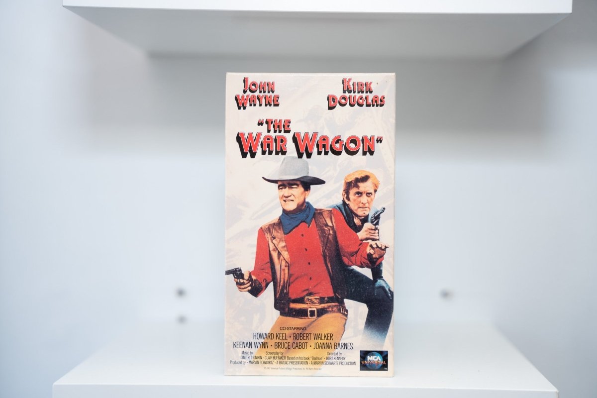 VHS The War Wagon painted cover John Wayne red shirt Kirk Douglas revolvers THE WAR WAGON red black text MCA Universal
