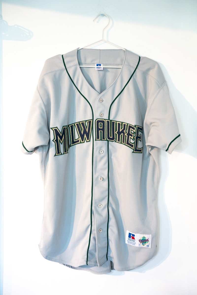 Gray vintage 90s Russell Athletic Diamond Collection Milwaukee Brewers away button-front baseball jersey dark green MILWAUKEE lettering gold outline piping size 48
