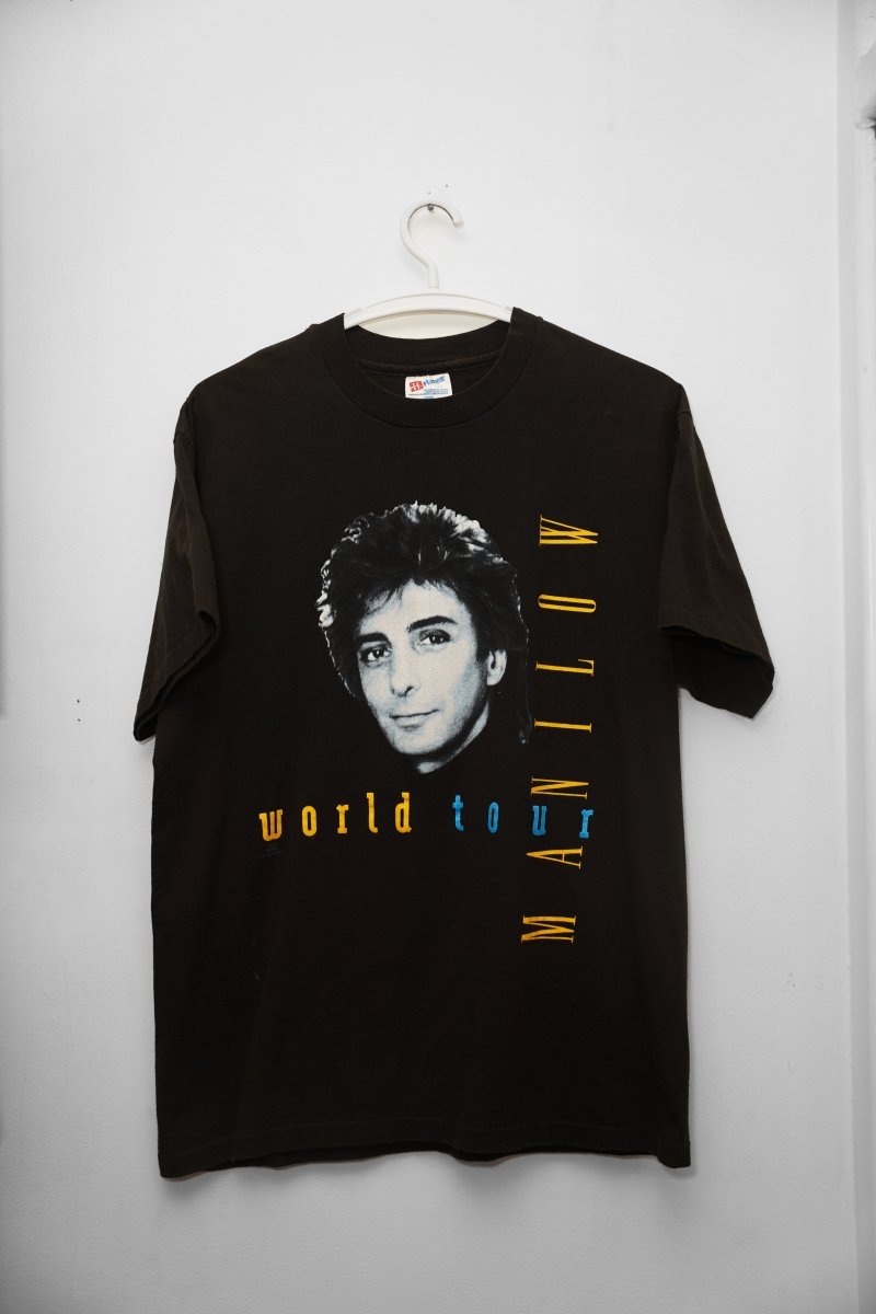 Vintage Barry Manilow black World Tour tee large with black and white portrait, world tour in blue text, MANILOW in blue and gold vertical text