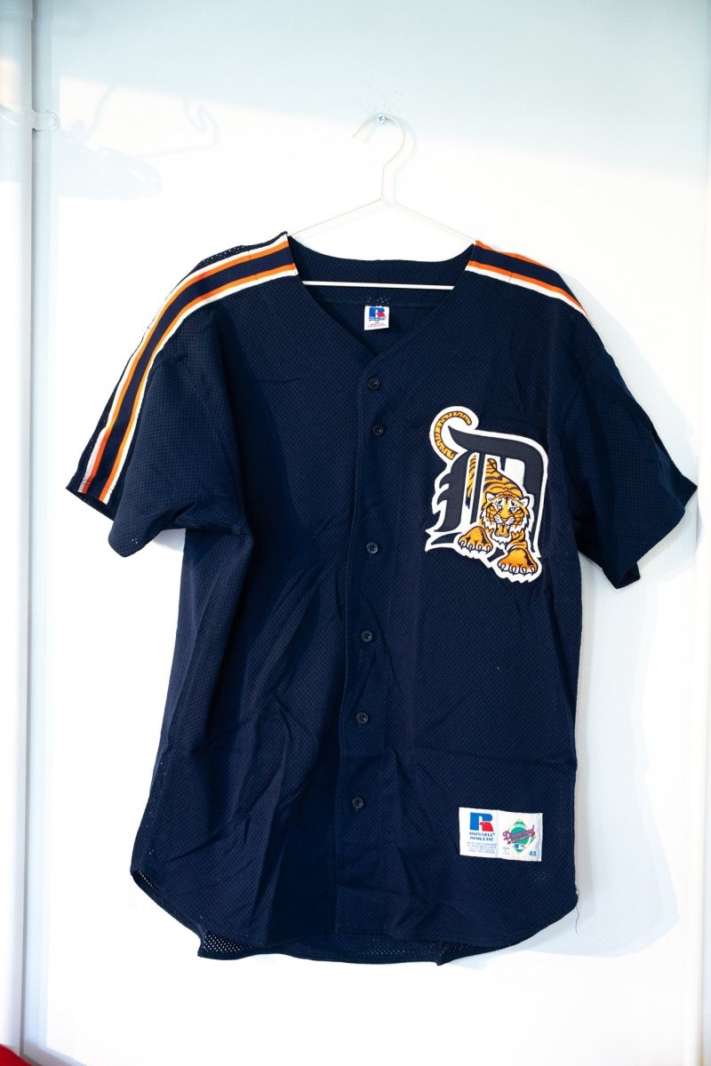 Navy blue vintage Russell Athletic Diamond Collection Detroit Tigers button-front jersey tiger D logo orange white striped sleeve trim mesh size 48