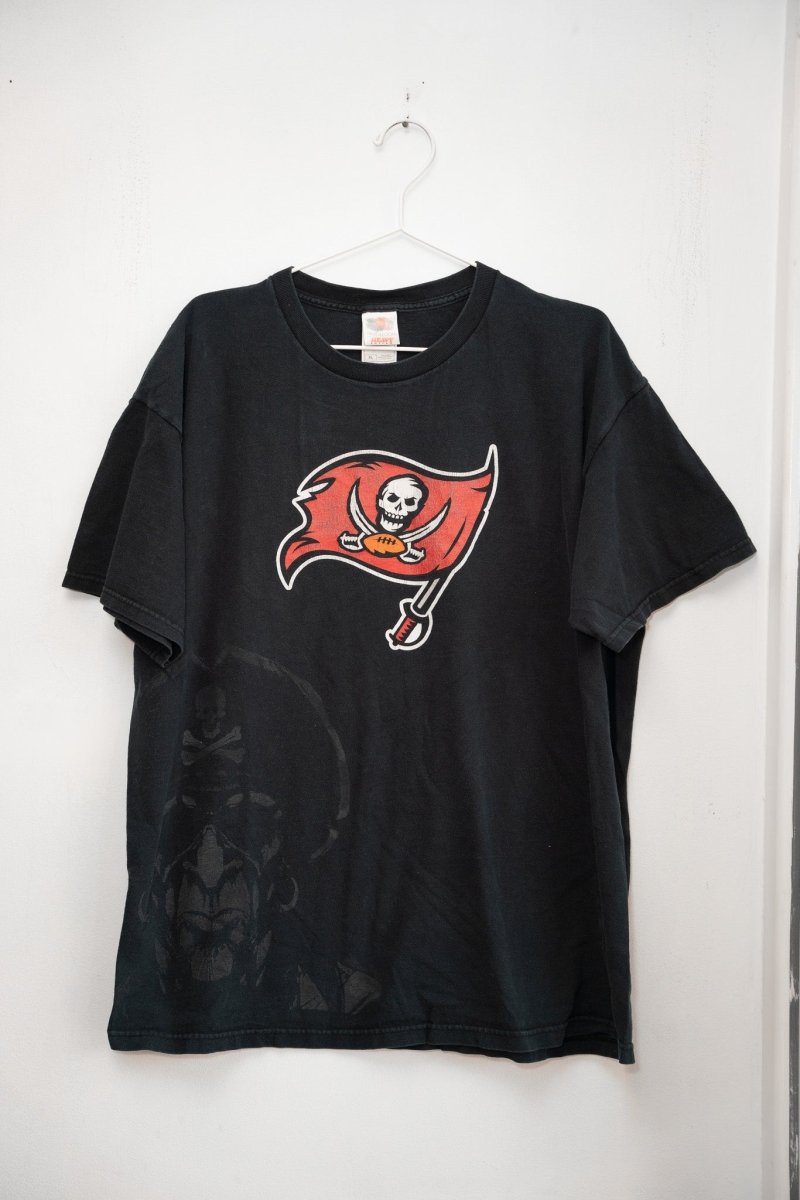 Black vintage Tampa Bay Buccaneers tee red pirate flag skull logo crossed swords tonal pirate watermark graphic NFL
