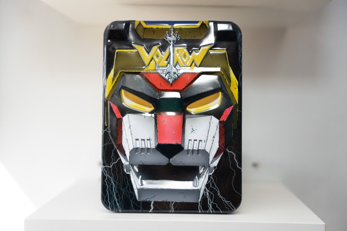 Voltron Collection Black Lion DVD set collector's tin embossed robotic lion face gold red black glowing eyes VOLTRON yellow text lightning