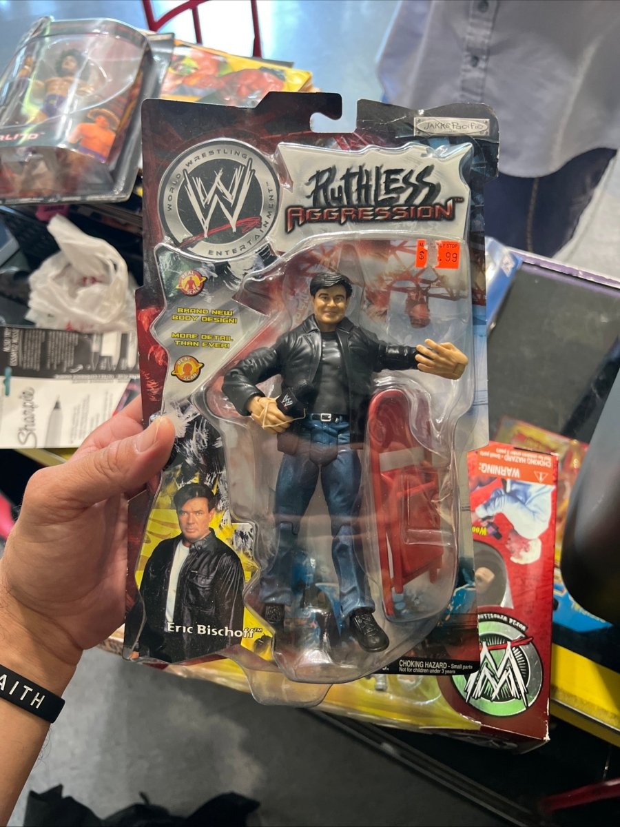 WWE Ruthless Aggression Eric Bischoff action figure with detailed sculpting and articulated joints, circa 2000s wrestling collectible