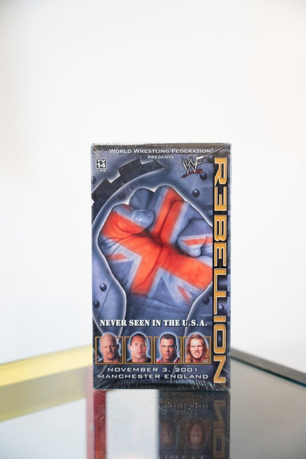 WWF Rebellion 2001 VHS tape sealed Union Jack fist punching through metal REBELLION gold text wrestler headshots Manchester England November 2001