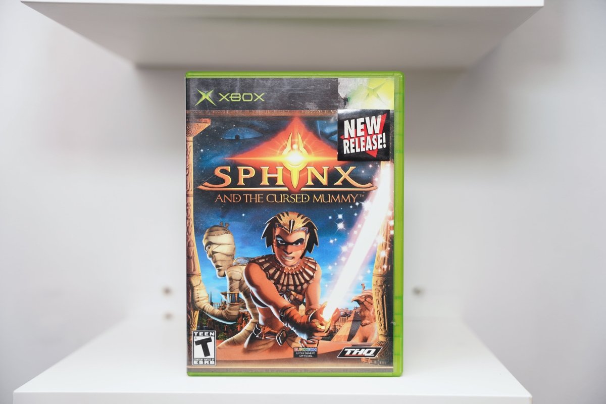 Xbox Sphinx and the Cursed Mummy case with Egyptian warrior and mummy character, pyramid and temples, New Release sticker, THQ logo