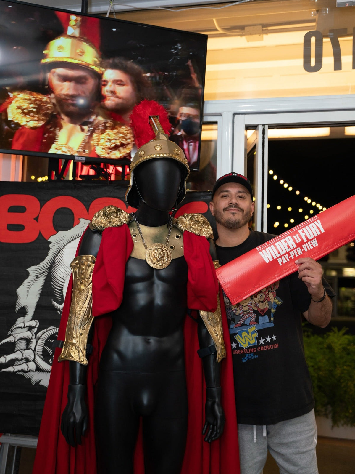Tyson Fury's Wilder II Spartan walkout uniform displayed at the Keep It Classic WrestleCon 2026 booth.
