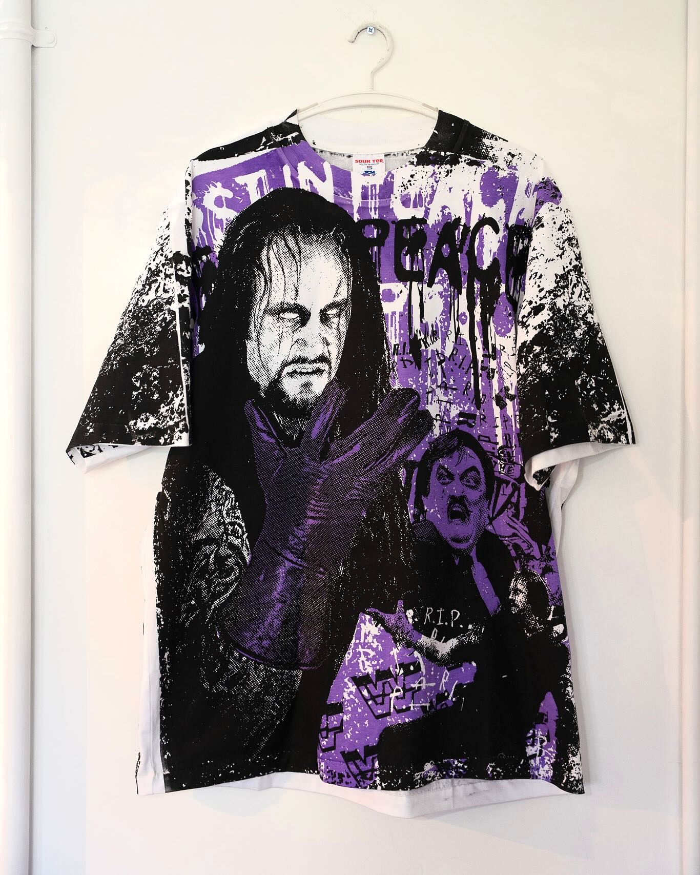 Vintage WWF t-shirts at Keep It Classic — Undertaker purple tee on hanger