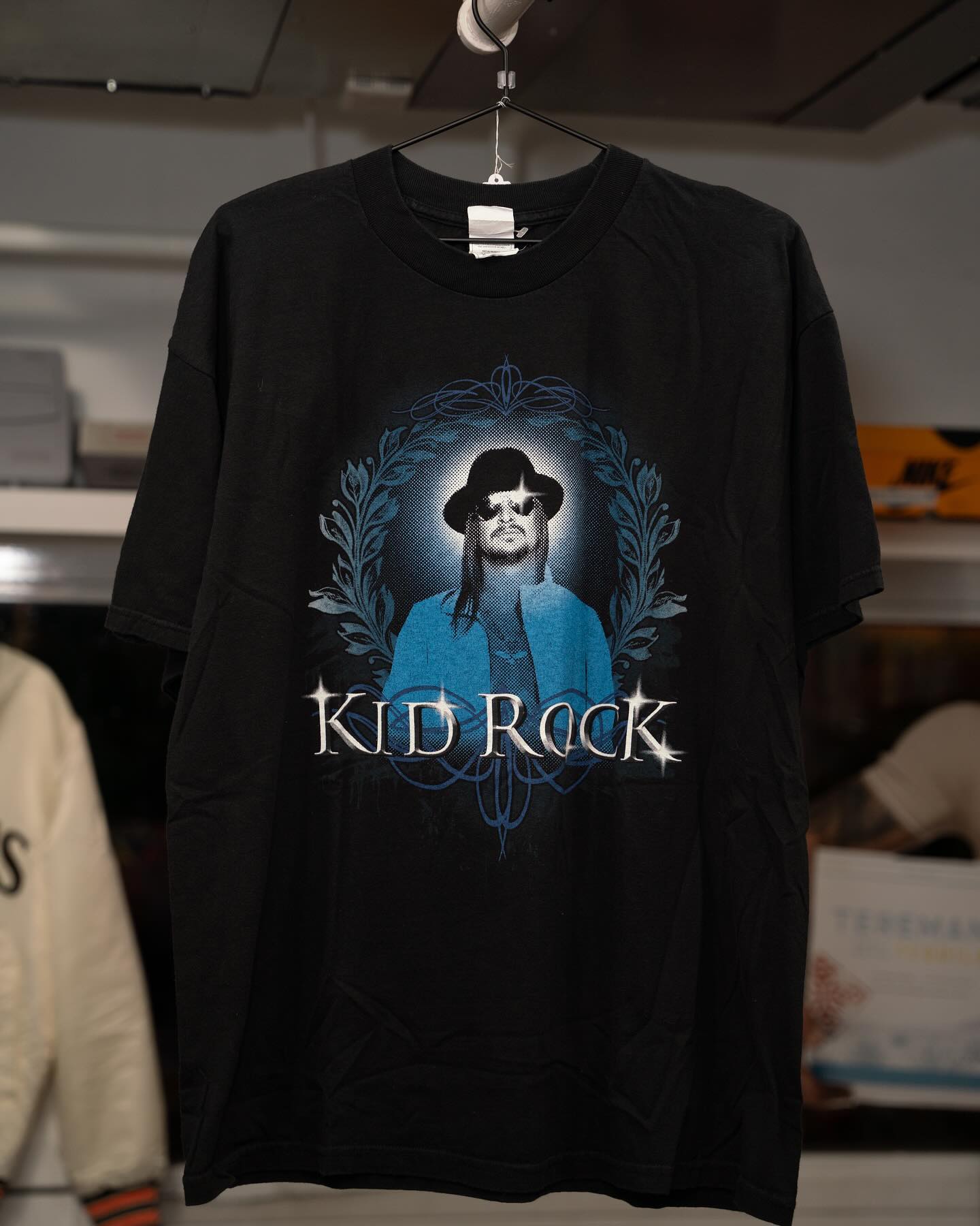 Y2K Kid Rock tour tee on hanger in Keep It Classic Las Vegas shop