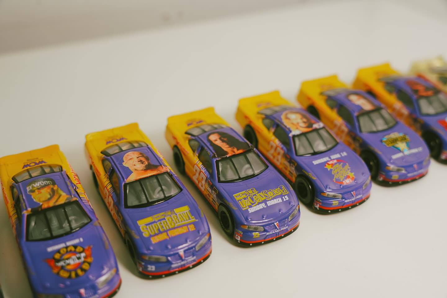 Row of vintage NASCAR die-cast cars at Keep It Classic
