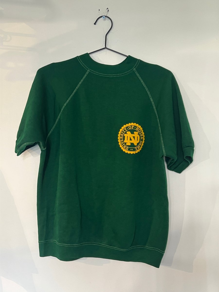Kelly green 1970s Champion University of Notre Dame short-sleeve raglan sweatshirt with gold ND seal on left chest