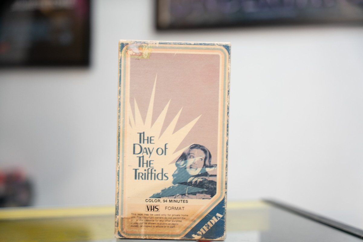 The Day of the Triffids VHS vintage sleeve with blue border pink cover bold serif title starburst design terrified woman and Media Home Entertainment release