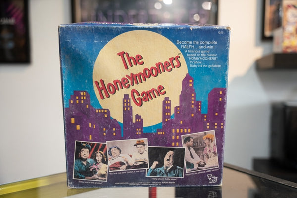 1986 The Honeymooners TSR board game blue purple box with NYC skyline golden moon red script title black and white TV stills Ralph Kramden quotes