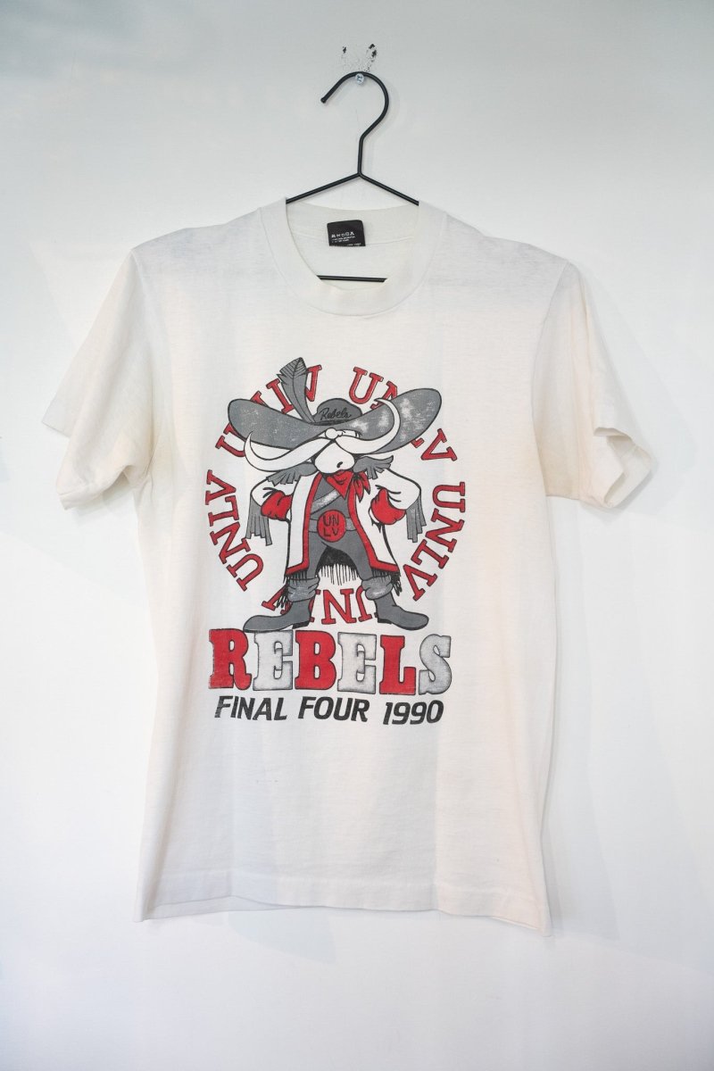 White 1990 UNLV Rebels Final Four t-shirt with Hey Reb mascot in cowboy hat surrounded by UNLV text and red REBELS lettering
