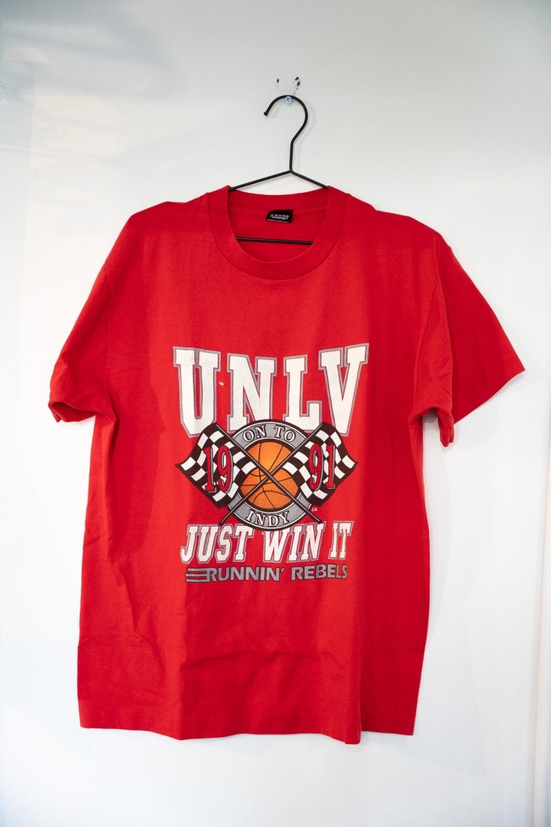 Red 1991 Screen Stars Best UNLV On To Indy shirt with basketball and checkered flags graphic and JUST WIN IT RUNNIN REBELS text