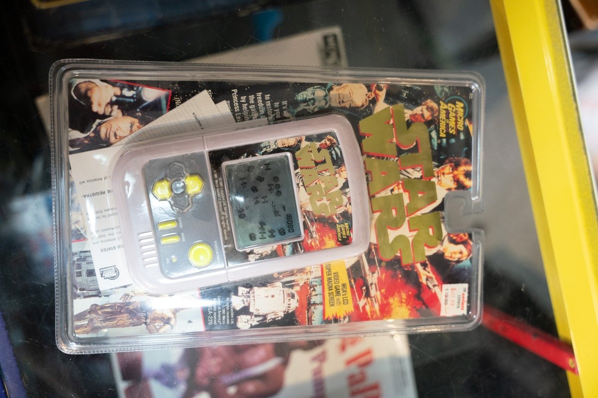 1991 Star Wars Micro Games of America handheld LCD video game sealed blister pack gray unit yellow buttons classic Star Wars logo original trilogy art