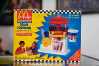 1993 McDonald's Happy Meal Magic Drink Fountain sealed in original yellow Mattel box with red yellow fountain toy golden arches logo and Kool-Aid included