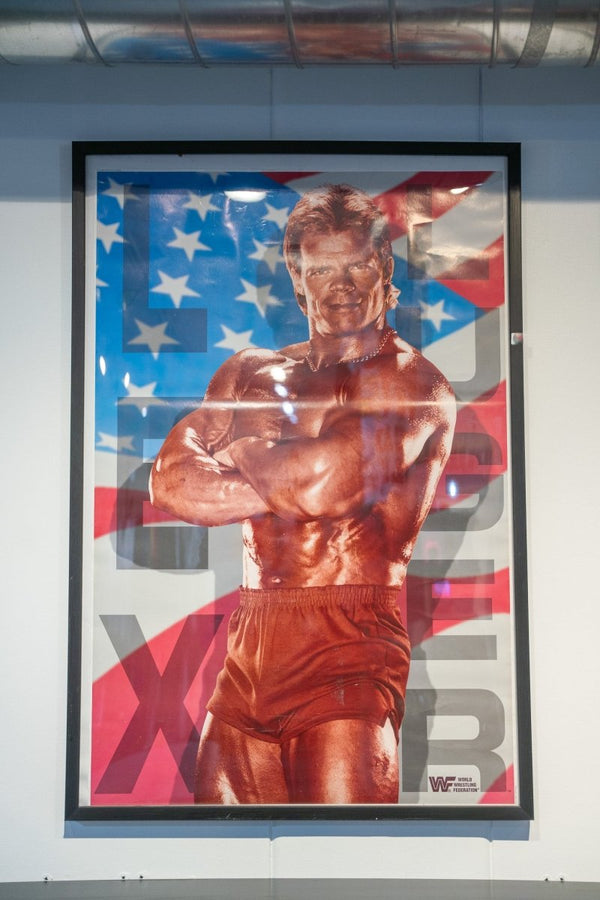 WWF Lex Luger poster framed muscular arms crossed red trunks American flag LUGER gray letters WWF World Wrestling Federation logo Titan Sports