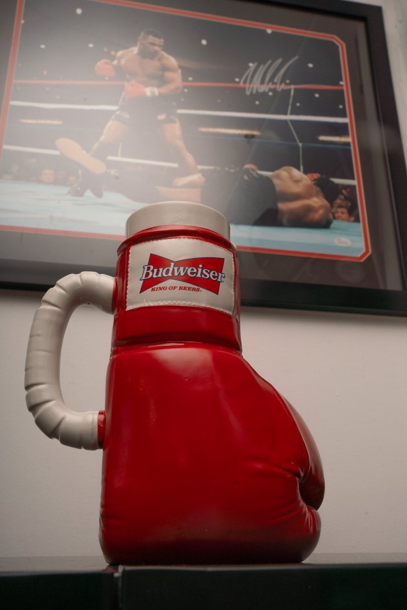 1997 Budweiser ceramic boxing glove beer stein in red with Budweiser bowtie logo and King of Beers text on white cuff