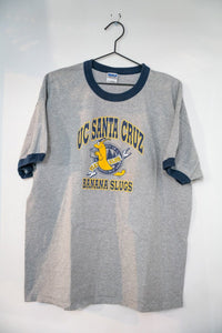 Heather gray UC Santa Cruz Banana Slugs ringer t-shirt with navy collar and cuffs yellow slug mascot and navy UC SANTA CRUZ lettering size XL