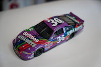 NASCAR 1998 Ernie Irvan #36 Skittles Wild Berry 1/24 scale diecast model car with red and multicolored livery