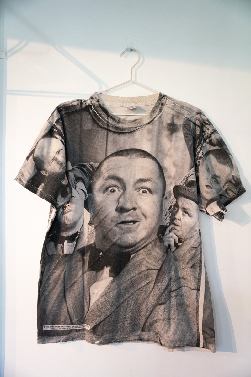 1998 Three Stooges all-over print tee with black and white photographic images of Moe Larry Curly multiple poses full-bleed print size Large