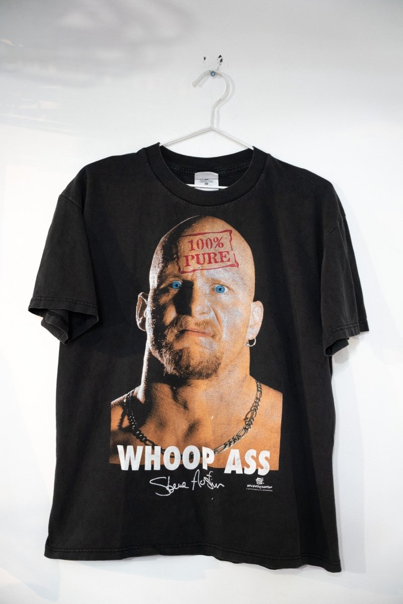 Black 1998 WWF Stone Cold Steve Austin shirt with 100% Pure stamp on forehead photo and WHOOP ASS text below