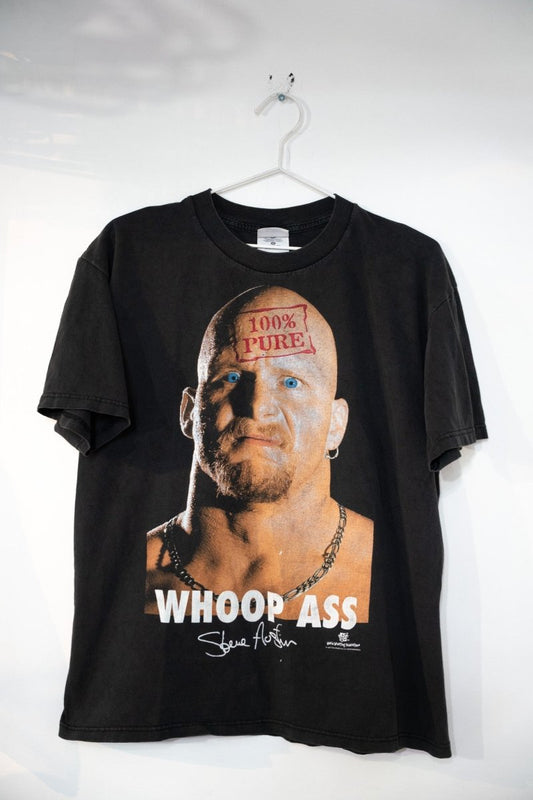 Black 1998 WWF Stone Cold Steve Austin shirt with 100% Pure stamp on forehead photo and WHOOP ASS text below