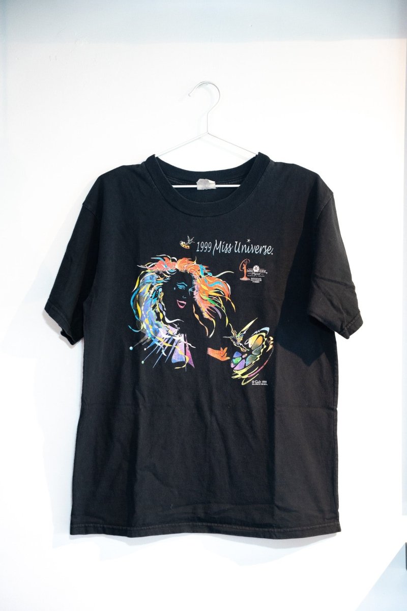 Black 1999 Miss Universe souvenir tee with colorful stained-glass-style woman illustration flowing multicolor hair butterfly artistic graphic size Large