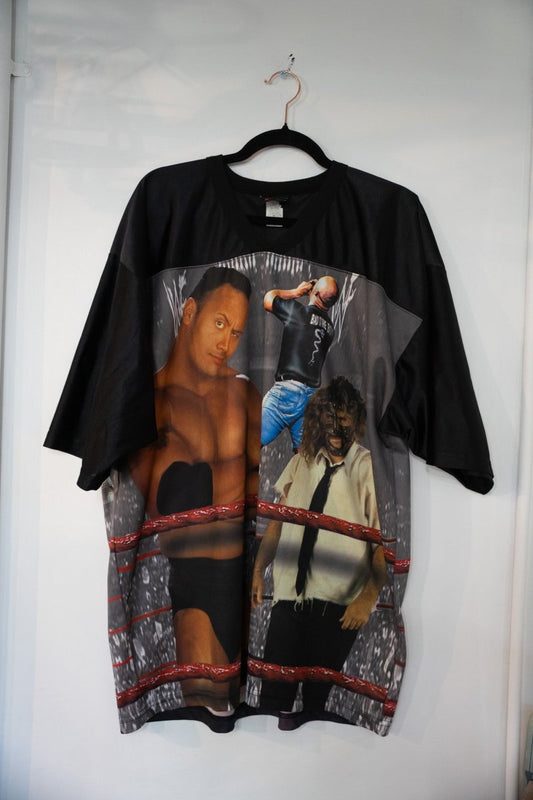 Black 1999 WWF Attitude War Zone mesh jersey with all-over sublimated print of The Rock Stone Cold Steve Austin and Mankind in ring cage backdrop size XL