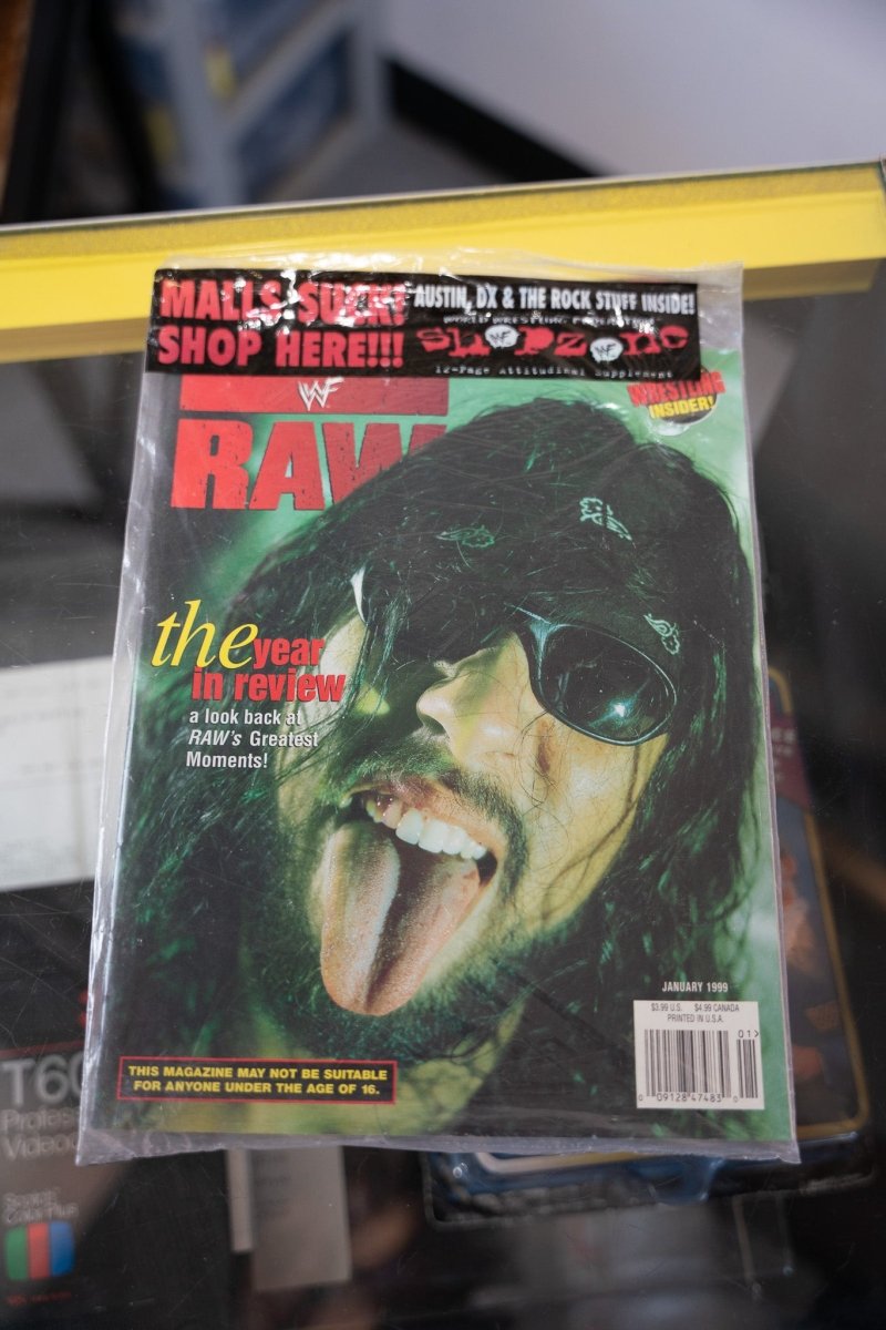 1999 WWF Raw Magazine January issue X-Pac cover close-up bandana sunglasses tongue out green lighting RAW red text Year in Review