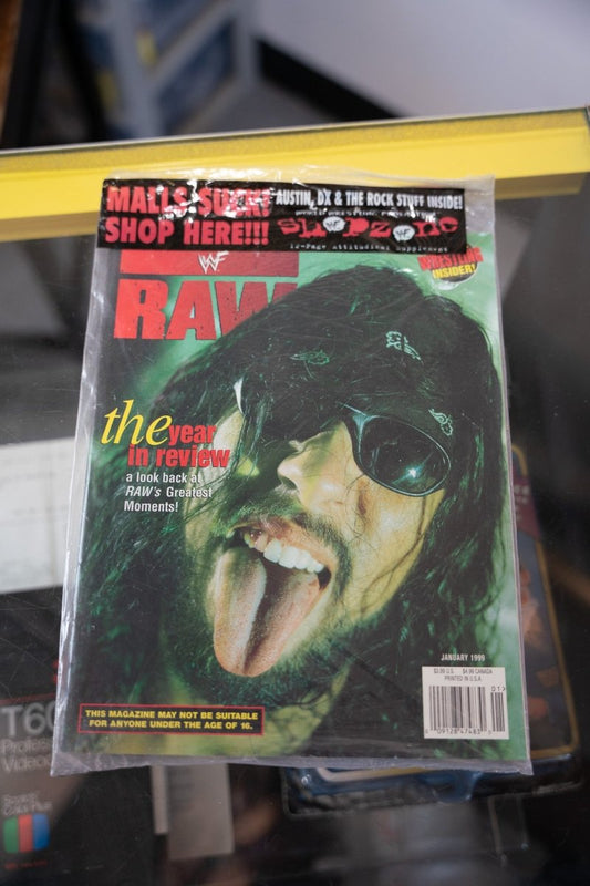 1999 WWF Raw Magazine January issue X-Pac cover close-up bandana sunglasses tongue out green lighting RAW red text Year in Review