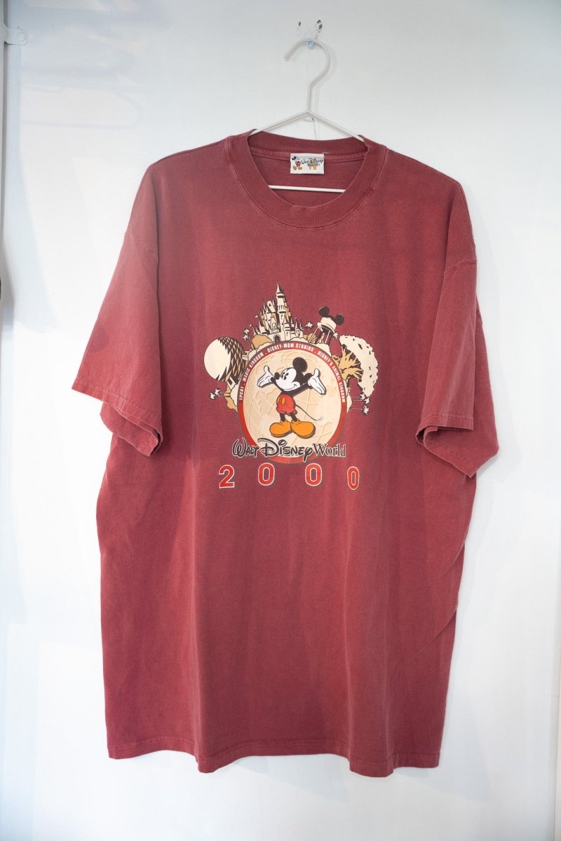 Burgundy 2000 Walt Disney World millennium t-shirt with Mickey on golden globe surrounded by park landmarks and Walt Disney World script size XXL