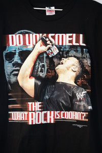 WWF The Rock "Do You Smell What The Rock Is Cookin?" graphic t-shirt in large, year 2000, featuring wrestling entertainment merchandise