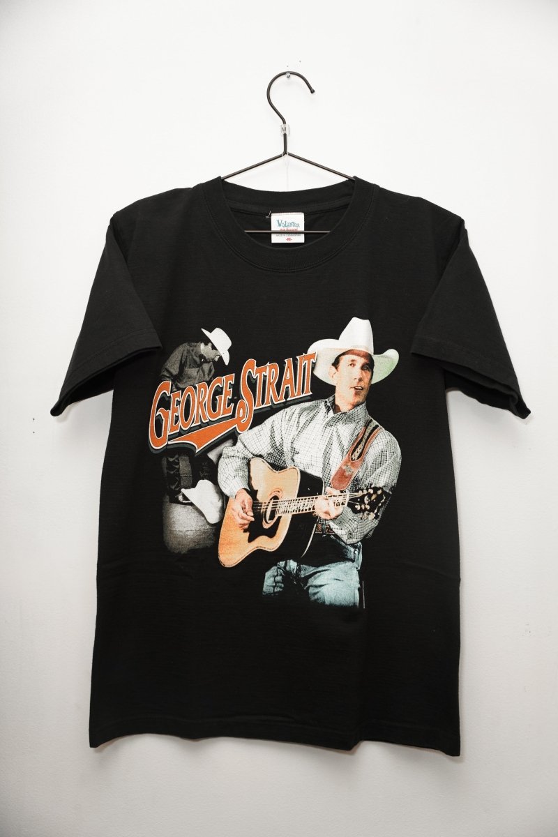 George Strait black concert tee medium with photo of Strait in white cowboy hat playing guitar, orange George Strait text