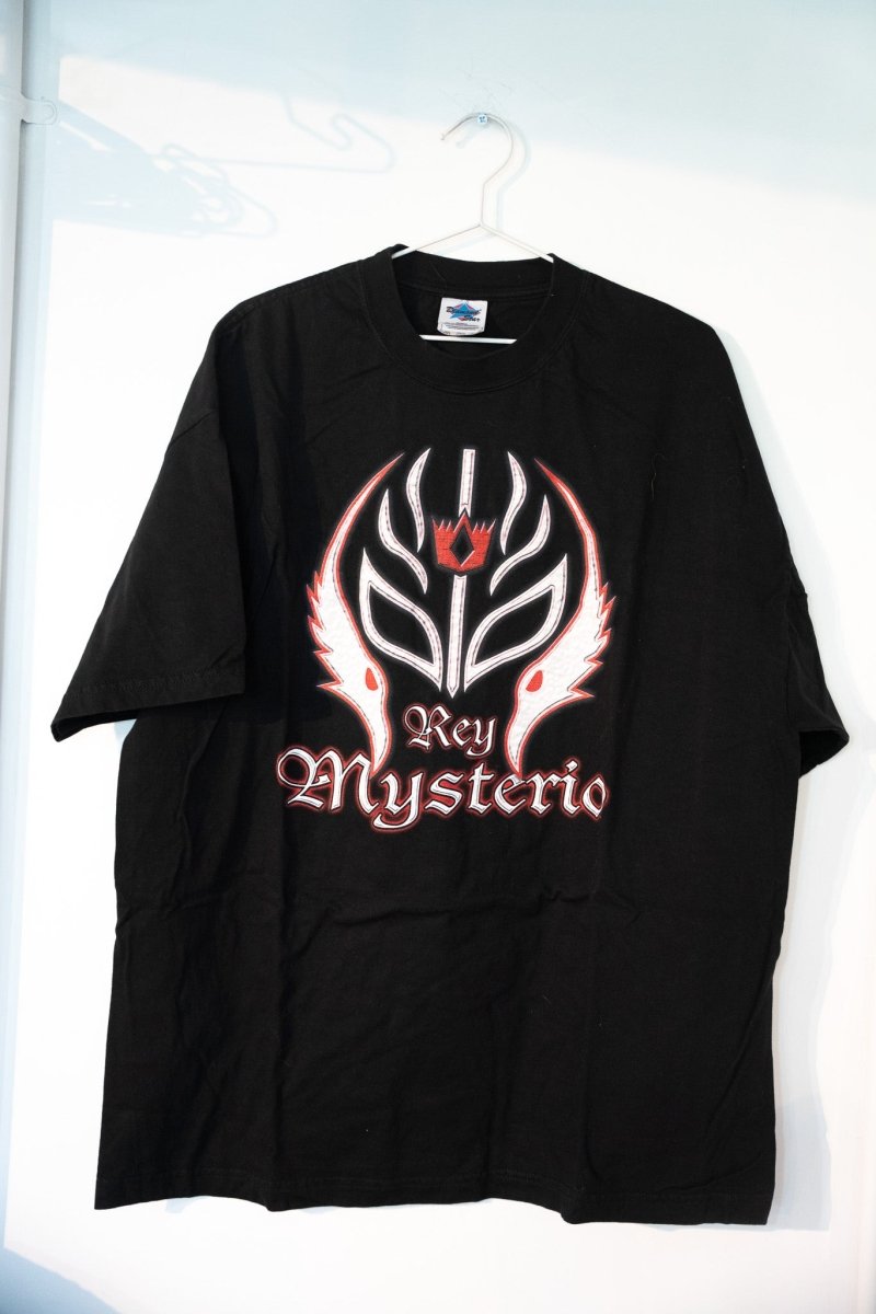 Black 2002 WWE Rey Mysterio tee with large white red stylized luchador mask graphic Rey Mysterio Gothic script size XXL