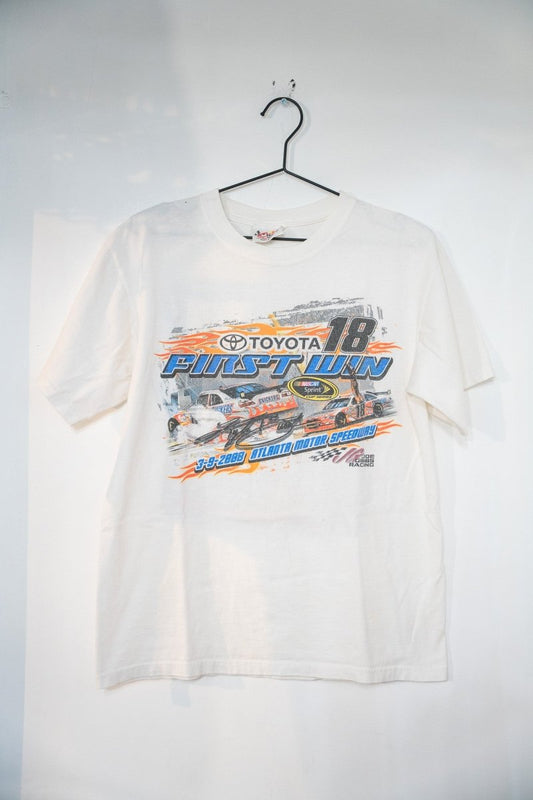 White 2008 NASCAR Kyle Busch First Win t-shirt with Toyota 18 Snickers car FIRST WIN orange lettering Atlanta Motor Speedway date and Joe Gibbs Racing logo size Medium
