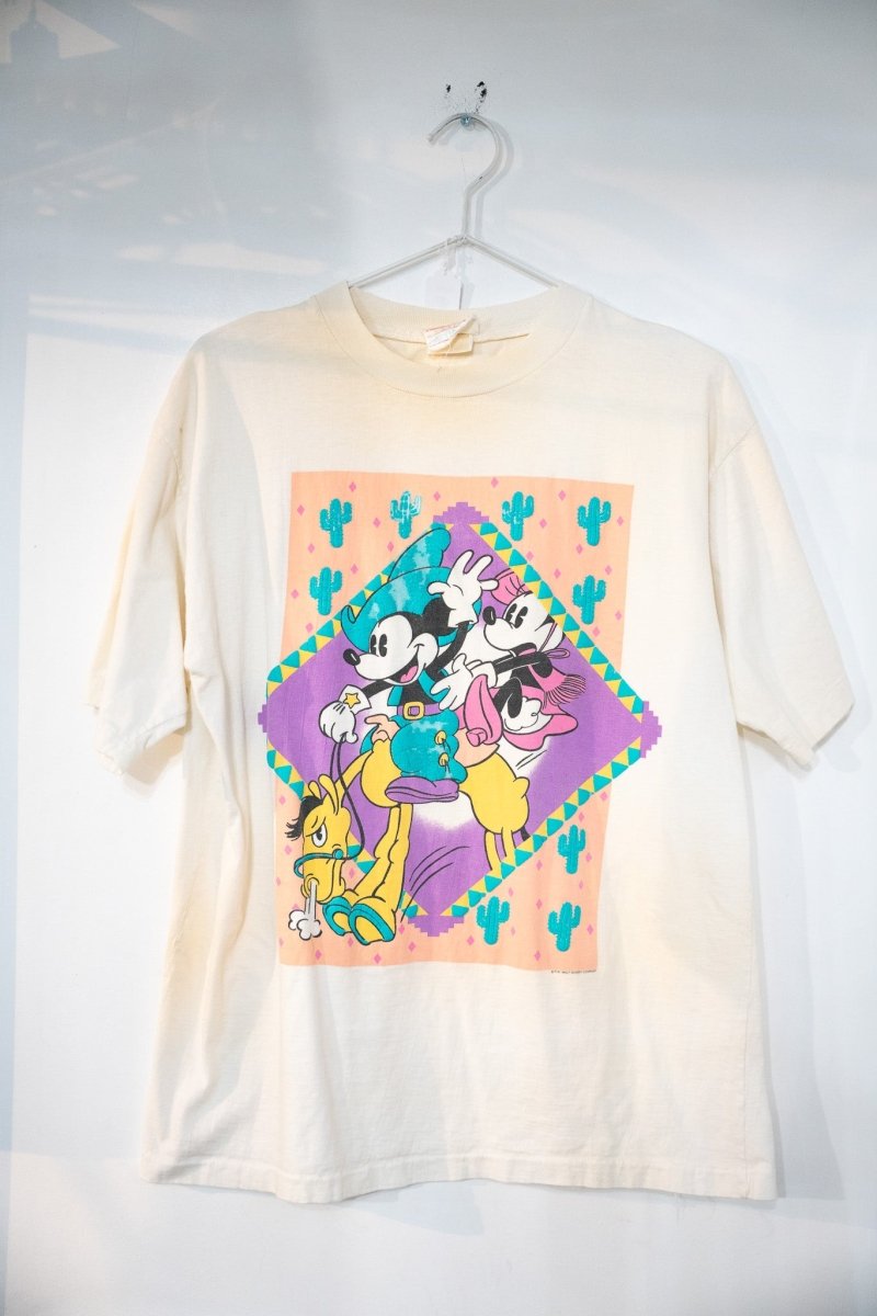 Cream 80s Disney Mickey Mouse Western themed t-shirt with cowboy Mickey Minnie riding Pluto in diamond frame with teal cactus and peach purple Southwestern patterns size Large
