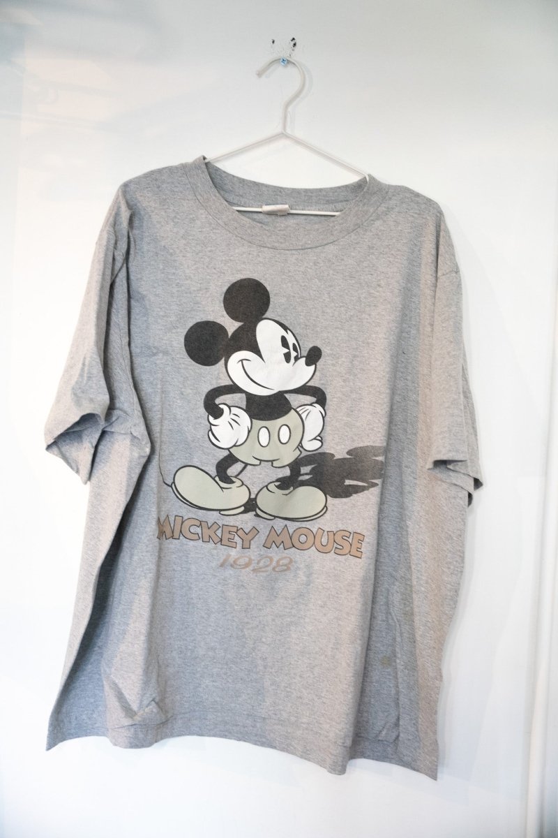 Heather gray 90s Disney Mickey Mouse 1928 shirt with large sepia-toned classic Mickey Mouse graphic and vintage block lettering
