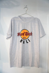 Hard Rock Cafe Bali graphic t-shirt in size XL from the 1990s, featuring printed logo and design on navy blue cotton fabric
