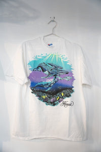 Shirt brand Hawaii Sea shirt from the 1990s in large size, displaying tropical print pattern in blue and green tones on cotton fabric