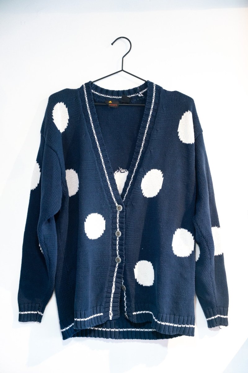 Liz Claiborne Liz Sport cardigan sweater from the 1990s in size large, displayed on a hanger showing the front button closure and ribbed knit details