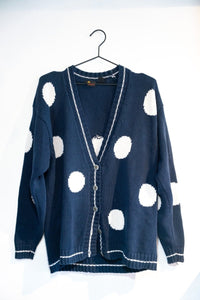 Liz Claiborne Liz Sport cardigan sweater from the 1990s in size large, displayed on a hanger showing the front button closure and ribbed knit details