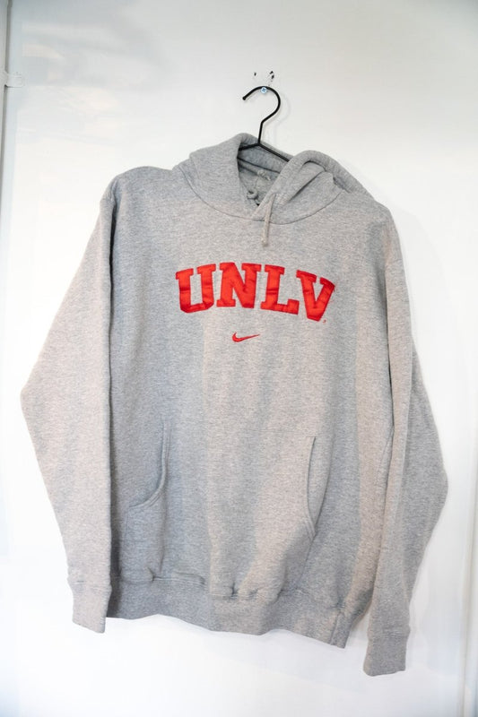 Heather gray 90s Nike UNLV pullover hoodie with large arched red UNLV block lettering and small red embroidered Nike Swoosh below
