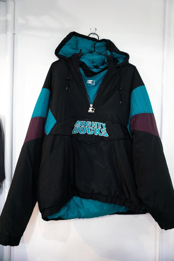 90s Starter Anaheim Mighty Ducks black teal and purple colorblock anorak puffer jacket with embroidered Mighty Ducks text and Starter logo