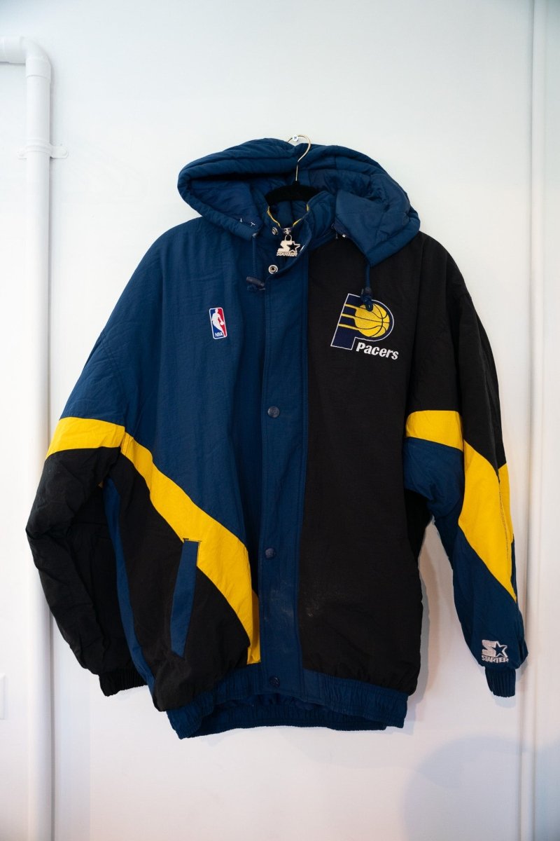 90s Starter Indiana Pacers hooded puffer jacket navy black gold diagonal color blocks embroidered P logo NBA patch snap front size Large