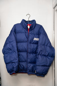 Royal blue 90s Starter Reversible New York Giants puffer jacket quilted GIANTS white text standing collar red lining Starter logo