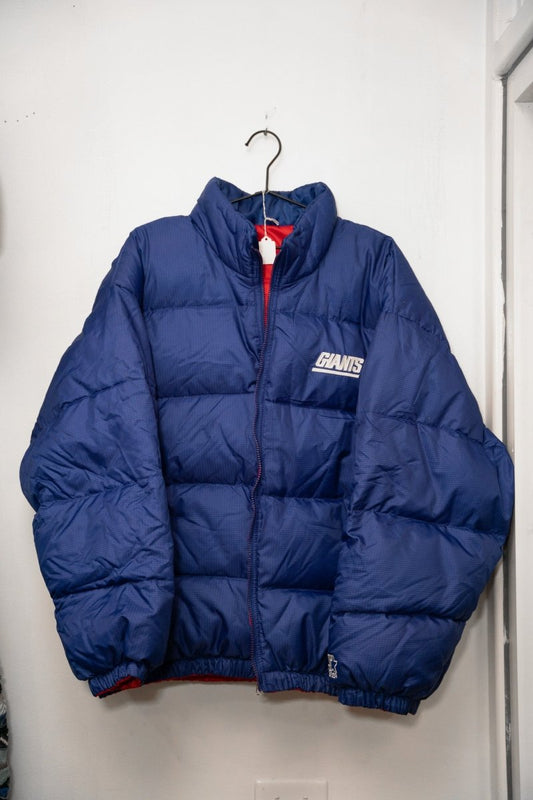 Royal blue 90s Starter Reversible New York Giants puffer jacket quilted GIANTS white text standing collar red lining Starter logo